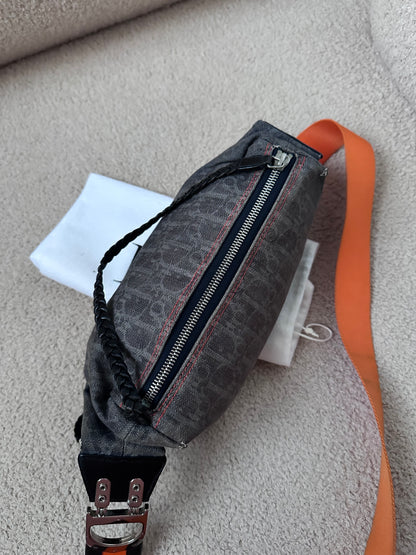 Dior by John Galliano “Remove before flight” Oblique Shoulder Bag