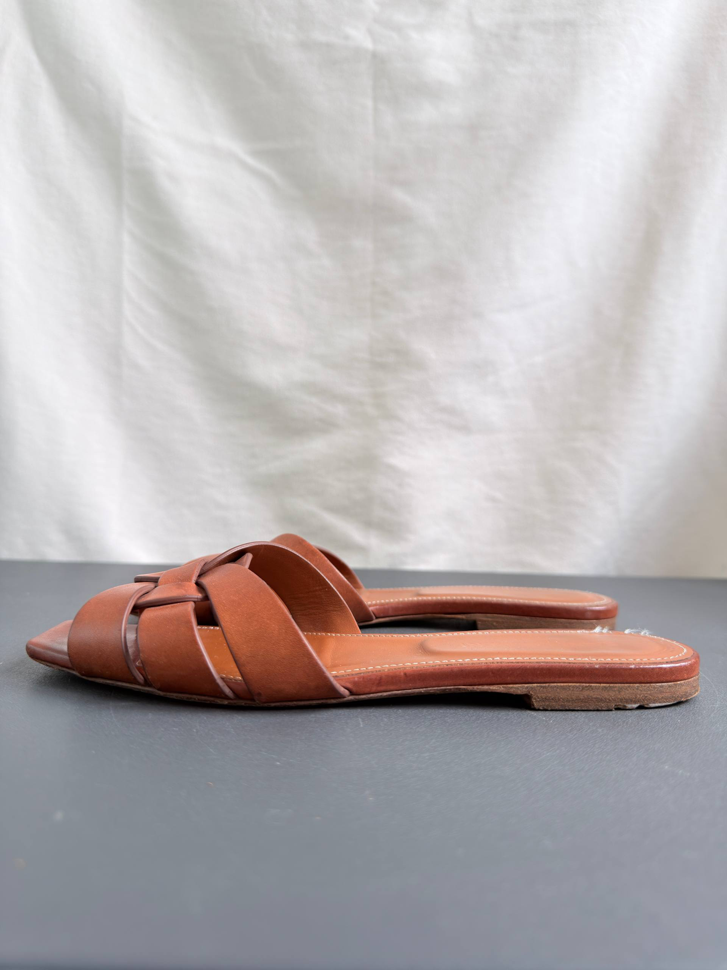 Yves Saint Laurent Tribute Mules in Smooth Leather Amber