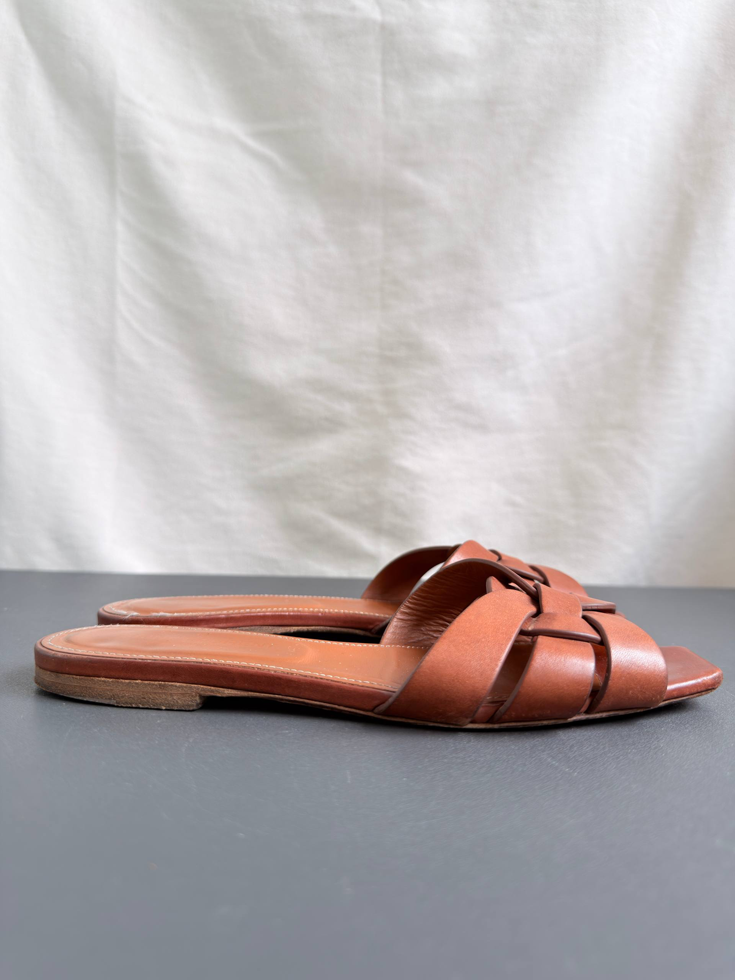 Yves Saint Laurent Tribute Mules in Smooth Leather Amber